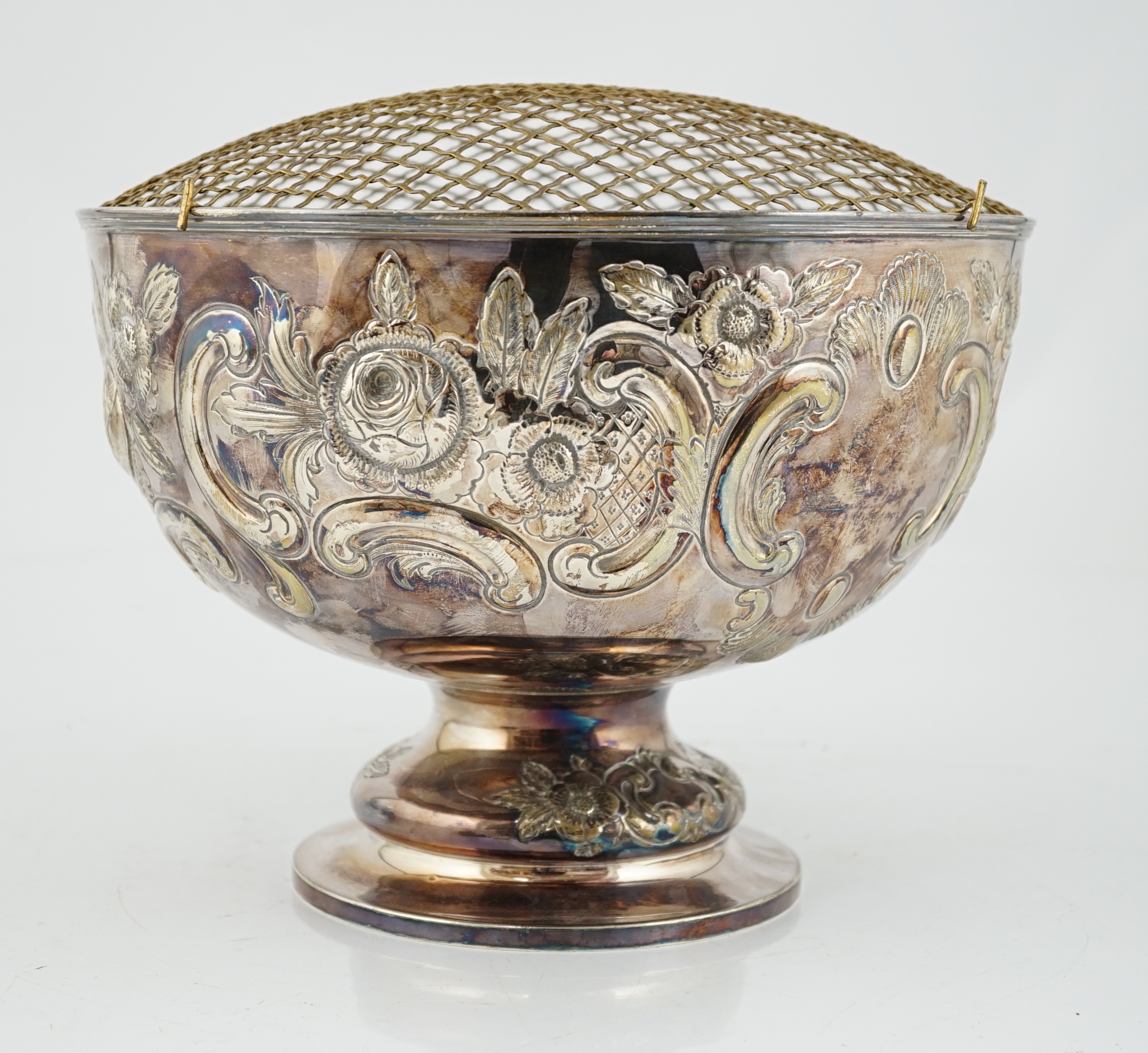 A large Edwardian repousse silver rose bowl, by Carrington & Co